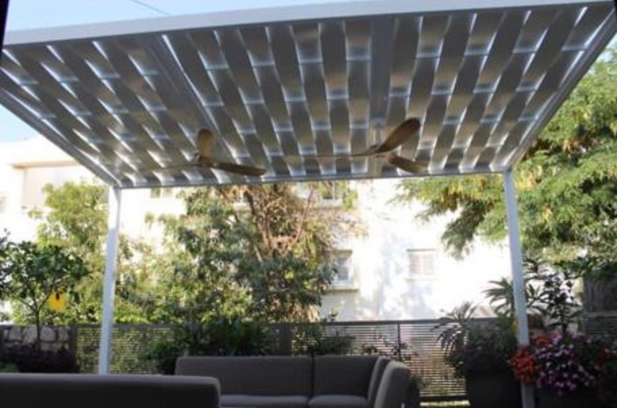 Wave-pattern aluminum shade panels seen from below